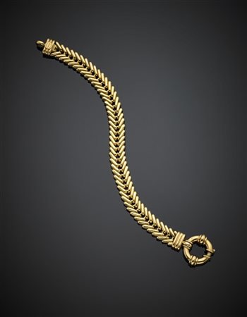 FAVERO
Bracciale in oro giallo a lisca di pesce con moschettone, g 32,07, lungh