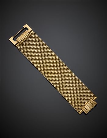 Bracciale in oro giallo a fascia intrecciata, g 126,98, lungh. cm 20, largh. cm