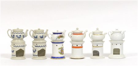 Gruppo di sei veilleuse in porcellana di diverso decoro e manifattura (difetti