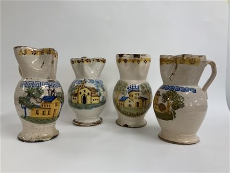 Gruppo di quattro brocche in maiolica dipinta decorate con edifici e motivi geo