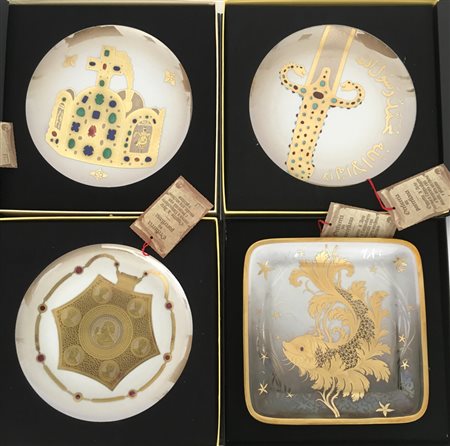 Cartone contenente sei piatti decorativi di diverse dimensioni e forme in scato