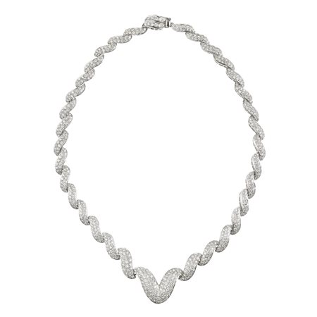COLLANA IN ORO BIANCO E DIAMANTI montatura semirigida a maglie sagomate...