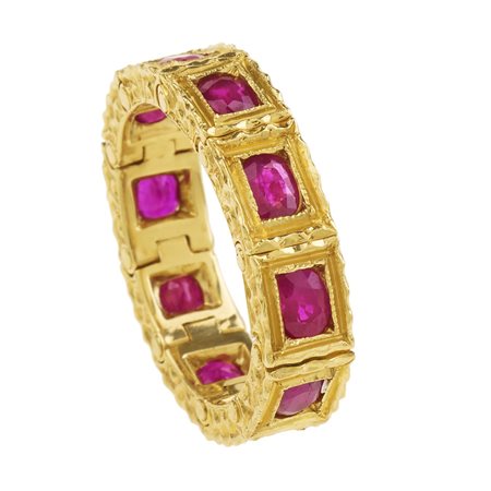 ANELLO IN ORO GIALLO E RUBINI realizzato a maglia semi-rigida in oro giallo...