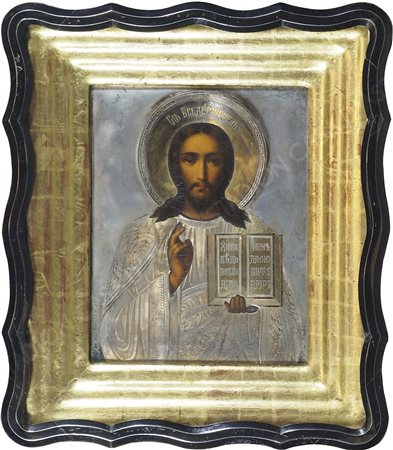 Icona dipinta su tavola raffigurante Santo, con riza in argento, entro teca...