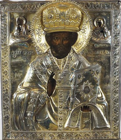 Icona dipinta su tavola raffigurante Santo con libro, riza in argento....