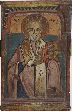 Icona dipinta su tavola scolpita raffigurante Santo. cm. 33x21.