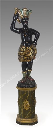 Scultura in legno dipinto raffigurante moretto, con base. H. tot cm. 155.