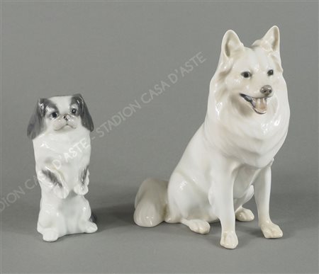 Royal Copenhagen: lotto di 2 cani in porcellana policroma. H. max cm. 18.