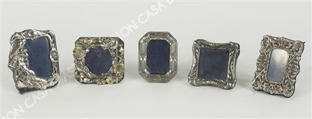 Lotto di 4 piccole cornici portafoto in argento.