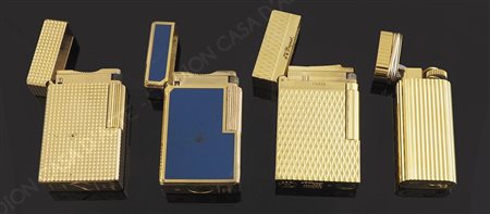 Lotto composto da 4 accendini in oro giallo e smalti