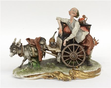 Manifattura del secolo XX. Suonatore di strada. Gruppo in porcellana decorata i