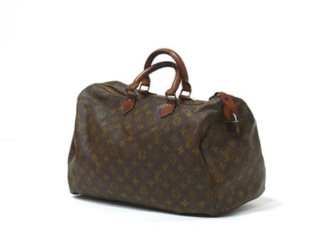 LOUIS VUITTON 
Borsa "Speedy" in tela Monogram, dettagli in vacchetta, con lucc