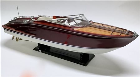 Modellino di motoscafo in legni vari, metallo e sedute in finta pelle (l cm 97)