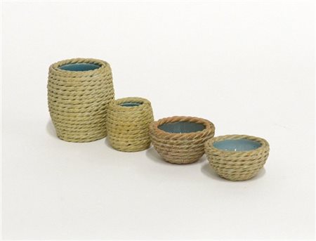 Zaccagnini Lotto di quattro vasetti in ceramica smaltata in celeste e con decora