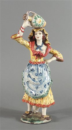 Scultura in ceramica policroma raffigurante portatrice d'acqua. H. cm. 37,5.