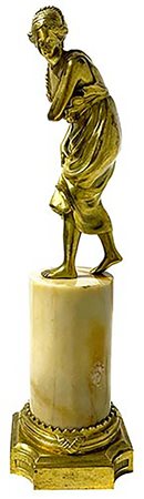 Statuetta in bronzo dorato in ormolu su base a colonna in onice. Periodo...