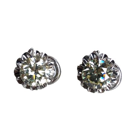 ORECCHINI IN ORO BIANCO 18K Ciascuno realizzato come una clip a lobo...