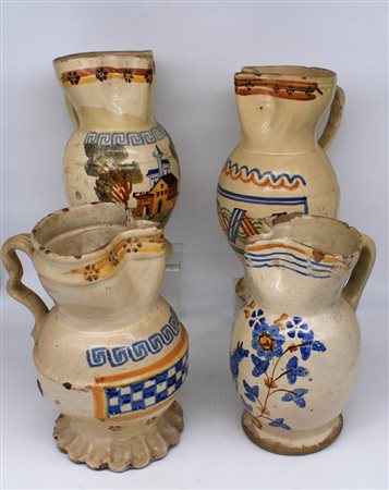 Quattro brocche in maiolica smaltata - Four enameled majolica jugs