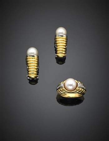 Demi parure composta da anello e orecchini in oro giallo e bianco rifinita con