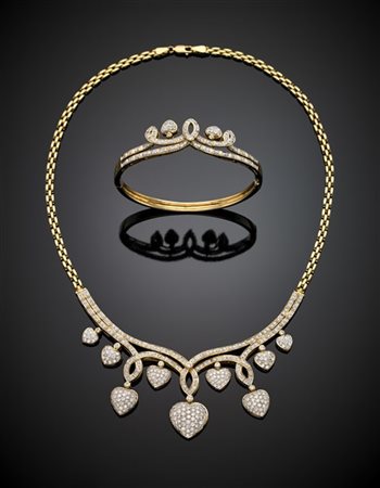 Demi parure in oro giallo e diamanti per complessivi ct. 7 circa composta da co