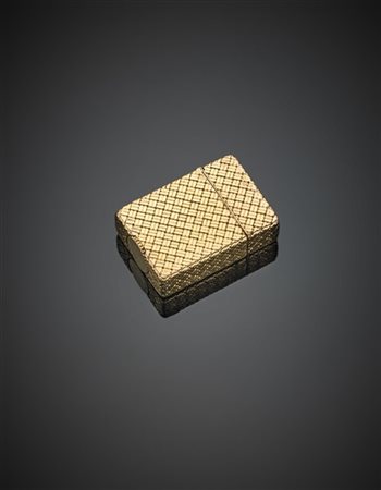 VAN CLEEF & ARPELS
Accendino inscatolato in oro giallo con lavorazione a cestin