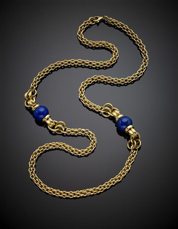 Lunga collana in oro giallo rifinita con due boule in lapis di mm 18.20 circa,