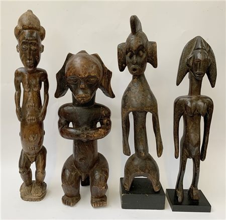 Arte africana, lotto di quattro figure in legno scolpito, misure diverse (difet
