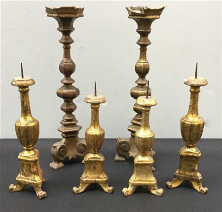 Lotto composto da sei candelieri diversi in legno (difetti)