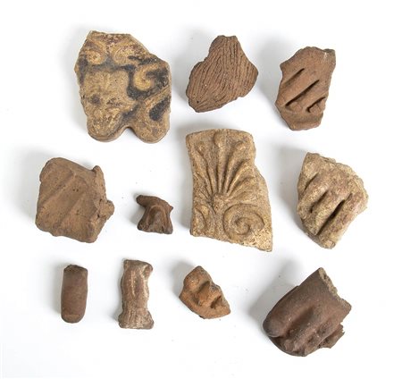 GRUPPO DI UNDICI TERRECOTTE<br>IV - II secolo a.C.