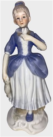 Statua in porcellana di Capodimonte, donna con fiore. H Cm 19