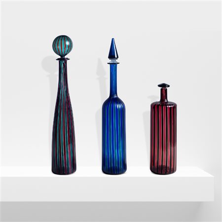 Venini (3)Murano,1981h. 47,5-46-31 cm.tre bottiglie serie Morandiane in vetro...