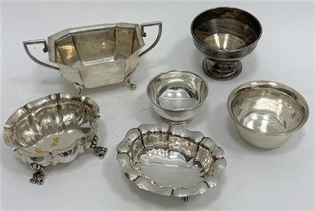 Lotto composto da sei alzate di diversa fattura in argento (g 600 ca.)