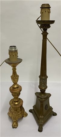 Lotto composto da due candelieri del secolo XIX in legno dorato e rame (difetti