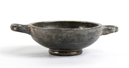 Apulian Black-Glazed Small Double Handled Bowl, 4th - 3rd century BC; height cm 4,5, diam. cm 11,5