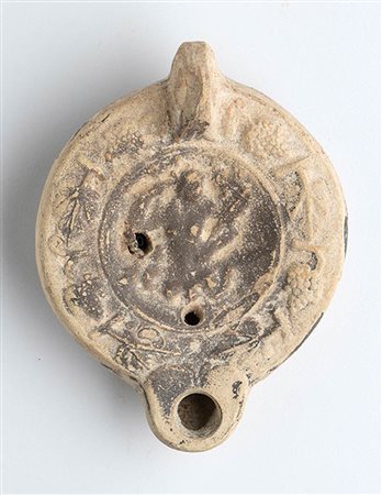 Roman Oil Lamp with Triton, 1st - 2nd century AD; height cm 5, length cm 11,3