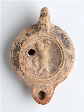 Roman Oil Lamp with Dancing Satyr, 1st - 2nd century AD; height cm 4,5, length cm 11