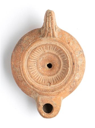 Roman Oil Lamp with Rays on Centre, 1st - 2nd century AD; height cm 4,5, length 11