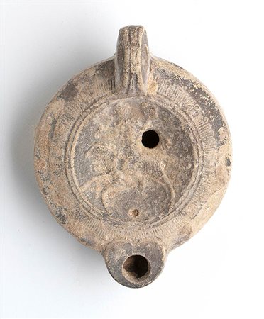 Roman Oil Lamp with Mercury Galloping on a Ram, 1st - 2nd century AD; height cm 4,5, length cm 10