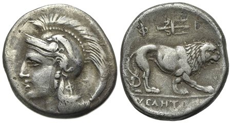 Northern Lucania, Velia, Didrachm, ca. 300-280 BC; AR (g 7.19; mm 20; h 12). Philistion Group. Head of Athena l., wearing crested Attic helmet, decorated with dolphin, Φ on neck-guard; Rv. Lion walking r.; above, Φ-I flanking trid