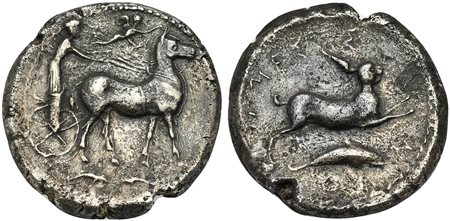 Sicily, Messana, Tetradrachm, 425-421 BC; AR (g 16,23; mm 26; h 6); Charioteer, holding reins in both hands, driving slow biga of mules r.; above, Nike flying r., crowning mules; in exergue, two dolphins; Rv. Hare springing r.; be