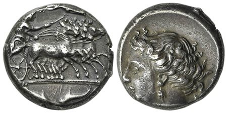 Sicily, Syracuse, Tetradrachm struck under the Second Democracy, ca. 466-405 BC. AR (g 17,11; mm 22,5; h 9). Charioteer driving fast quadriga r.; above, Nike flying l. crowning charioteer; in ex. two dolphins, Rv. Head of Arethusa