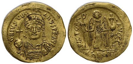 Justinian I (527-565); AV Solidus (g 4,47; mm 21; h 6); Constantinople, 545-565; Helmeted and cuirassed bust facing, holding globus cruciger and shield; Rv. Angel standing facing, holding staff terminating in Christogram and globu