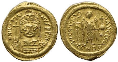 Justinian I (527-565); AV Solidus (g 4,48; mm 20; h 6); Constantinople, 545-565; Helmeted and cuirassed bust facing, holding globus cruciger and shield; Rv. Angel standing facing, holding staff terminating in Christogram and globu