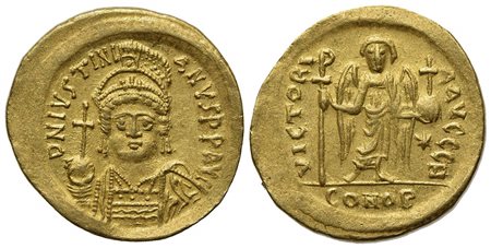 Justinian I (527-565); AV Solidus (g 4,48; mm 20,5; h 6); Constantinople, 545-565; Helmeted and cuirassed bust facing, holding globus cruciger and shield; Rv. Angel standing facing, holding staff terminating in Christogram and glo