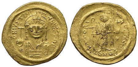 Justinian I (527-565); AV Solidus (g 4,41; mm 20,5; h 6); Constantinople, 545-565; Helmeted and cuirassed bust facing, holding globus cruciger and shield; Rv. Angel standing facing, holding staff terminating in Christogram and glo