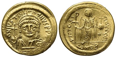 Justinian I (527-565); AV Solidus (g 4,26; mm 19,5; h 6); Constantinople, 545-565; Helmeted and cuirassed bust facing, holding globus cruciger and shield; Rv. Angel standing facing, holding staff terminating in Christogram and glo