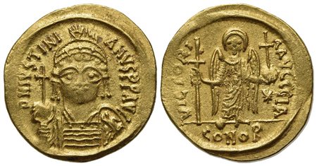 Justinian I (527-565); AV Solidus (g 4,40; mm 19,5; h 6); Carthage, year 11 (AD 547/8); Helmeted and cuirassed bust facing, holding globus cruciger and shield decorated with soldier on horseback riding r.; Rv. Angel standing facin