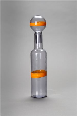 MANIFATTURA MURANESE  - Bottiglia in vetro azzurrino  con applicazione di fascia in vetro giallo su tappo e corpo. Anni ‘70.