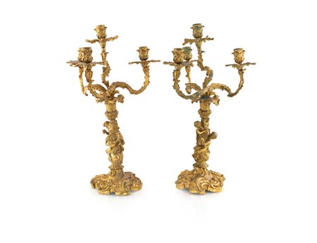 Coppia di candelabri in bronzo dorato, Francia XIX secolo - a quattro luci...