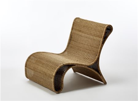 Poltrona con struttura in tubolare metallico e midollino. Italia, anni '60. (cm 69x75x85) (difetti) 